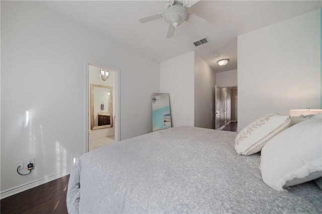 bedroom featuring hardwood / wood-style flooring, ceiling fan, and ensuite bathroom