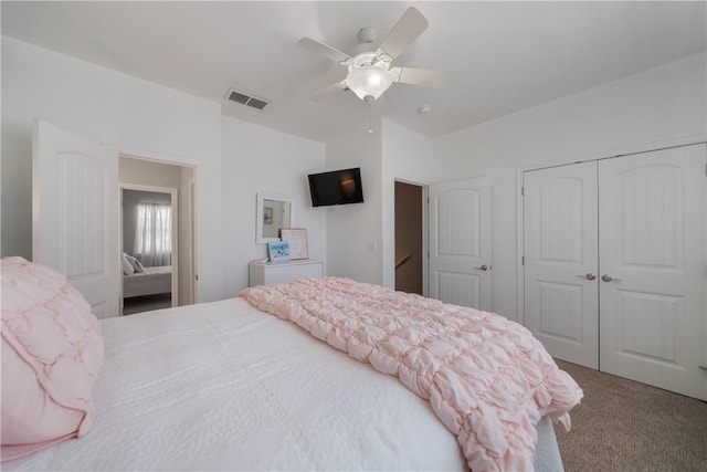 bedroom featuring carpet, ceiling fan, and a closet