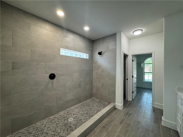 8038 Etienne Dr, Corpus Christi, TX 78414 - full bathroom featuring walk in shower, wood tiled floors, vanity, and recessed lighting