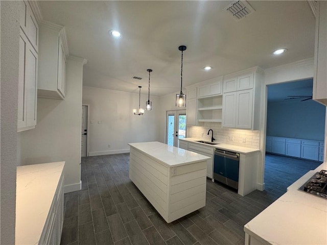 8038 Etienne Dr, Corpus Christi, TX 78414 - kitchen with stainless steel appliances, open shelves, a kitchen island, white cabinetry, and dark wood finished floors