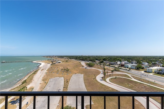 drone / aerial view featuring a water view and a view of the beach