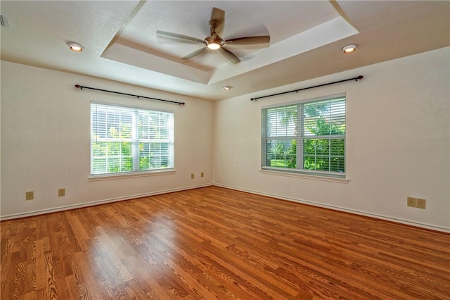 5372 County Road 73a, Robstown, TX 78380 - spare room with a tray ceiling, wood finished floors, a ceiling fan, and recessed lighting