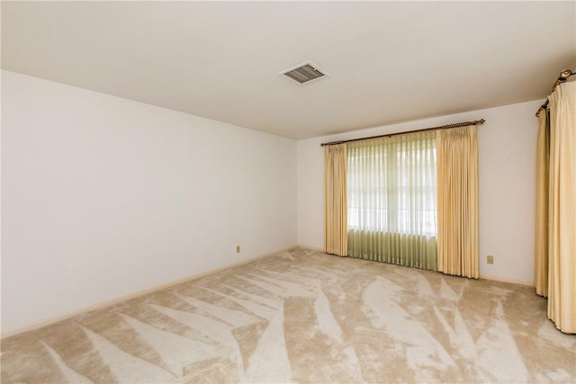 spare room featuring carpet