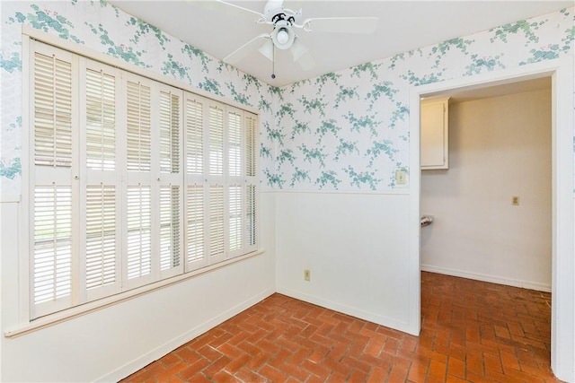 unfurnished room featuring ceiling fan