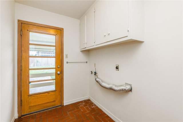 laundry area with cabinets and electric dryer hookup