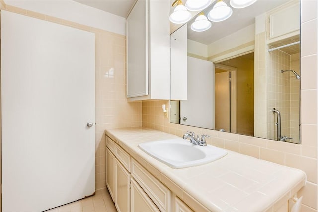 bathroom with tasteful backsplash, vanity, and tile patterned flooring