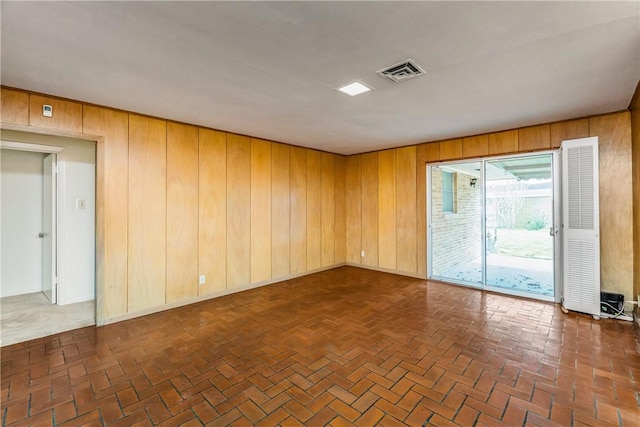 empty room with wood walls