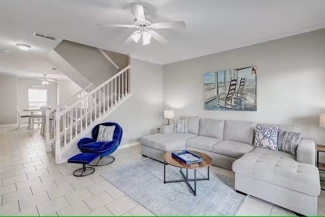 14202 Encantada Ave Unit 303, Corpus Christi, TX 78418 - tiled living area with a ceiling fan, stairway, and baseboards