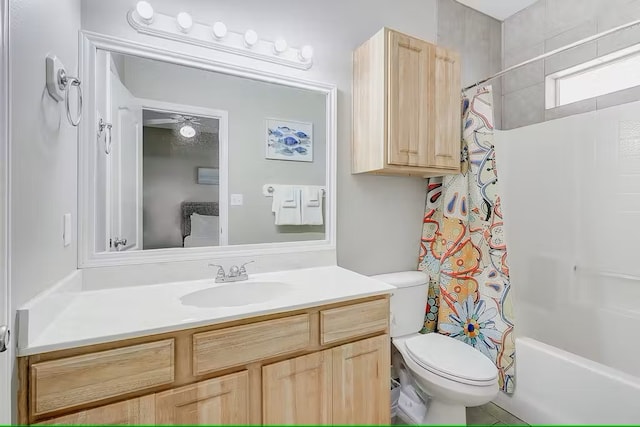 full bathroom with toilet, shower / tub combo with curtain, vanity, and ceiling fan