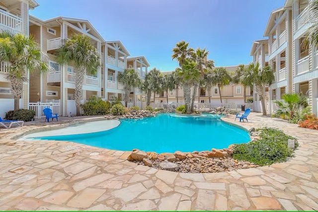 view of swimming pool with a patio