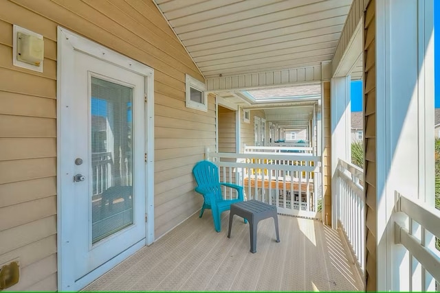 14202 Encantada Ave Unit 303, Corpus Christi, TX 78418 - wooden terrace with covered porch