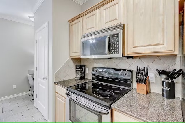 14202 Encantada Ave Unit 303, Corpus Christi, TX 78418 - kitchen with range with electric stovetop, stainless steel microwave, crown molding, decorative backsplash, and stone counters