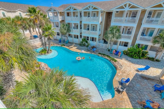 view of swimming pool with a patio area