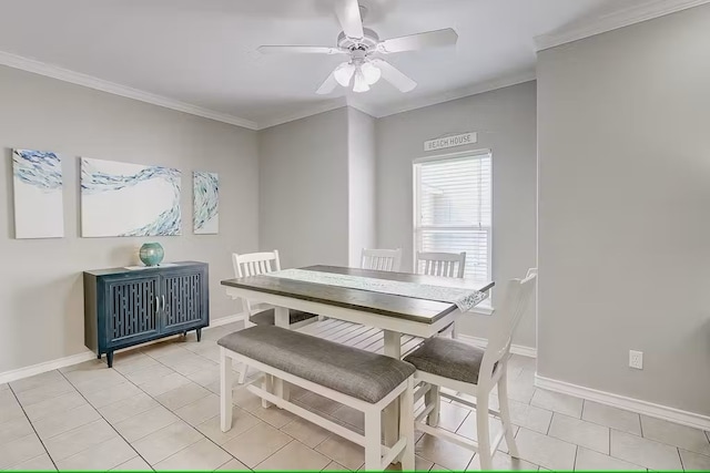 tiled dining space with ceiling fan and ornamental molding