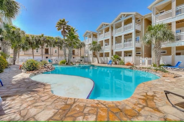 view of swimming pool with a patio area