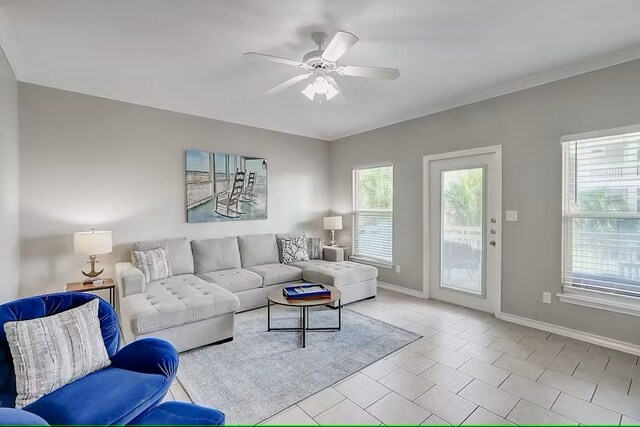 tiled living room featuring ceiling fan