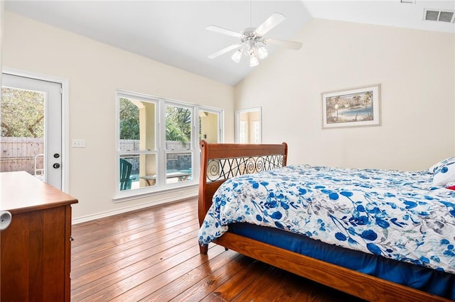 bedroom featuring lofted ceiling, visible vents, access to exterior, a ceiling fan, and wood-type flooring