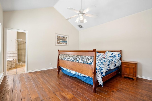 bedroom with visible vents, ensuite bathroom, baseboards, and hardwood / wood-style flooring