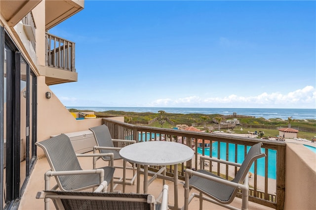 balcony featuring a water view