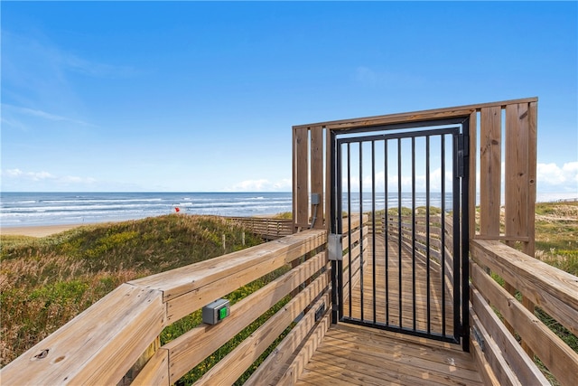 exterior space featuring a beach view and a water view