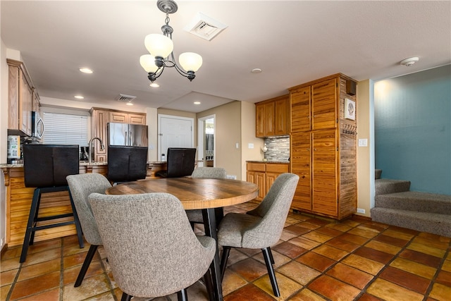 dining room featuring a chandelier