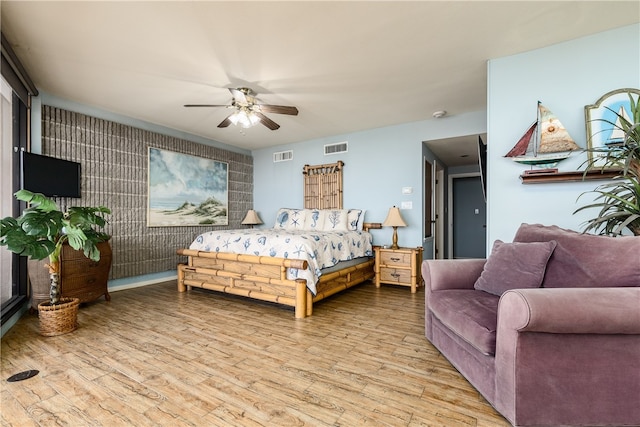 bedroom featuring ceiling fan and light wood-type flooring