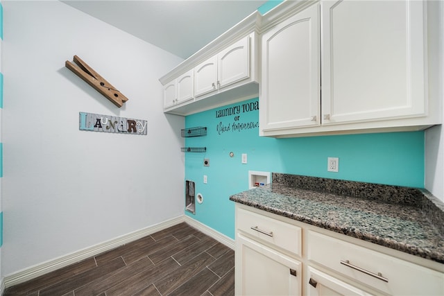 laundry room with cabinets, electric dryer hookup, dark hardwood / wood-style flooring, gas dryer hookup, and hookup for a washing machine