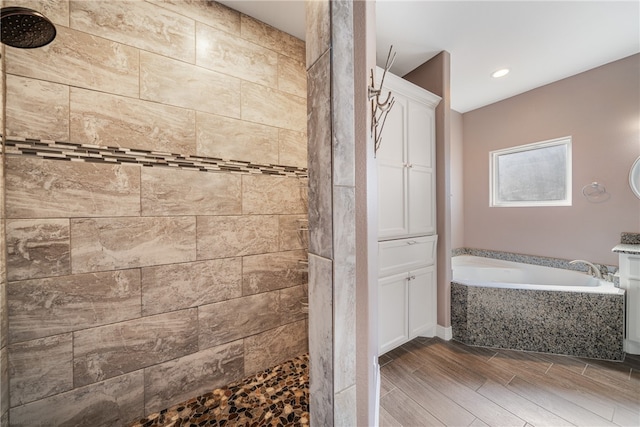 bathroom featuring vanity and independent shower and bath