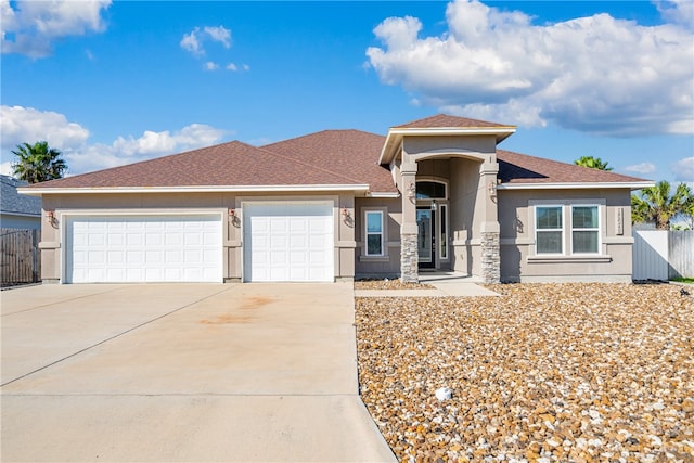 prairie-style home featuring a garage