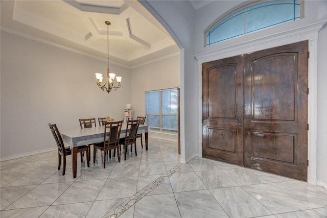 foyer featuring coffered ceiling, crown molding, a high ceiling, and a chandelier