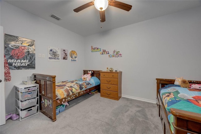 bedroom featuring ceiling fan and light carpet