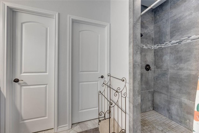 bathroom with tiled shower