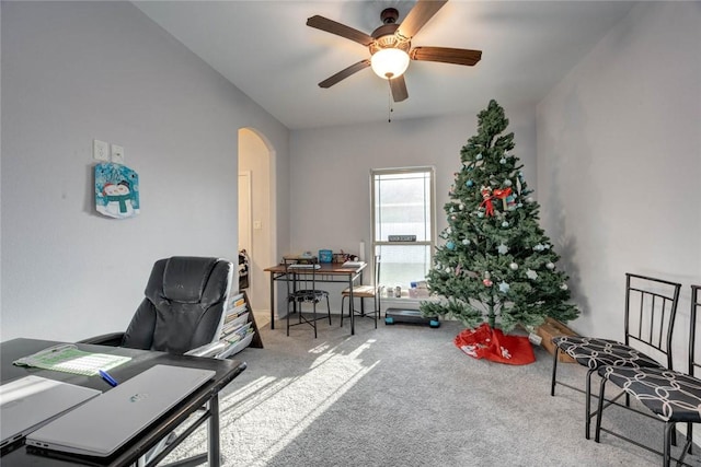 carpeted home office with ceiling fan