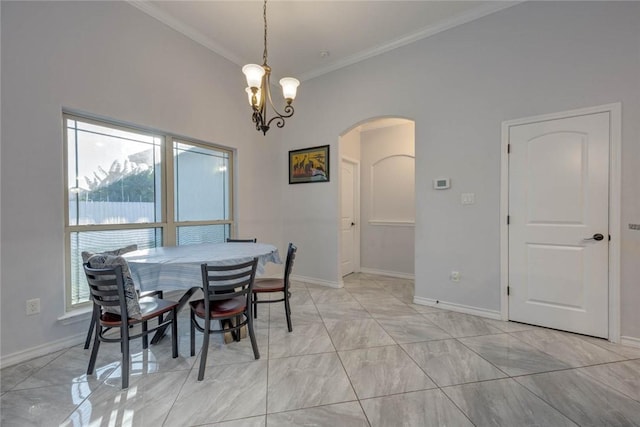 dining room featuring ornamental molding and a chandelier