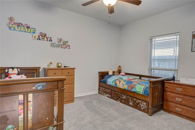 bedroom with light colored carpet and ceiling fan