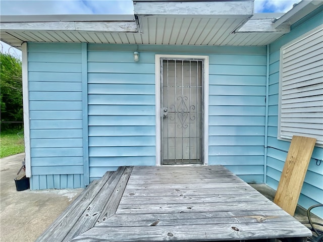 doorway to property with a wooden deck