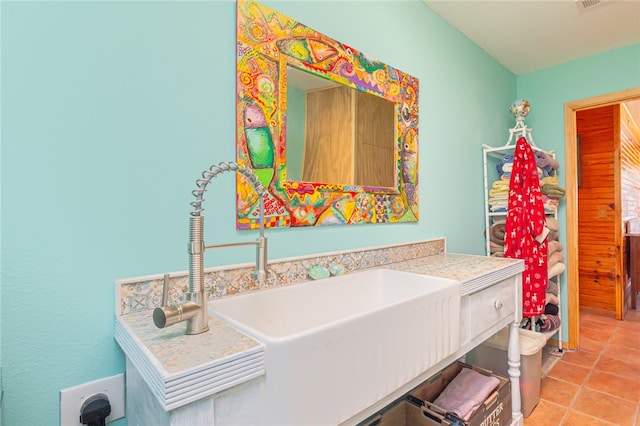 bathroom featuring tile patterned flooring and sink