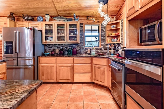 kitchen featuring dark stone counters, decorative backsplash, wooden ceiling, pendant lighting, and appliances with stainless steel finishes