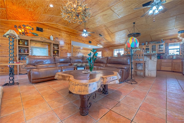 tiled living room featuring high vaulted ceiling, wood walls, wooden ceiling, and plenty of natural light