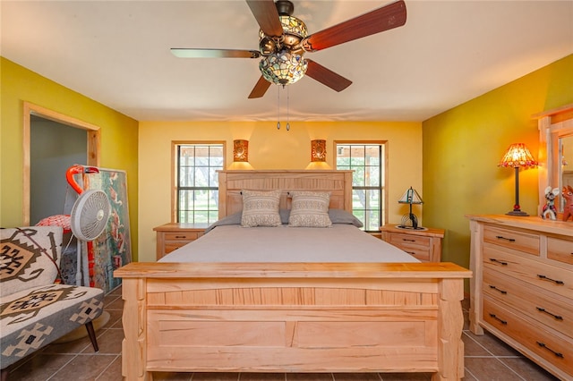 tiled bedroom with ceiling fan