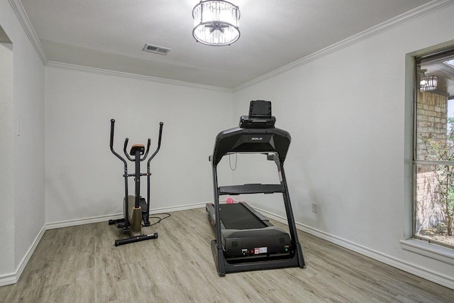 2307 Timber Ridge Dr, Portland, TX 78374 - exercise room with wood finished floors, ornamental molding, and plenty of natural light