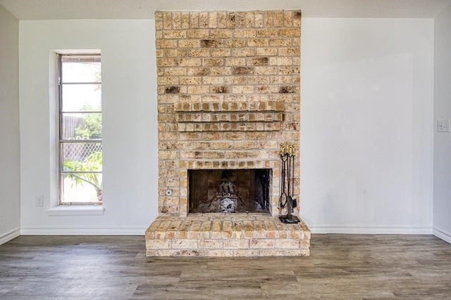 2307 Timber Ridge Dr, Portland, TX 78374 - detailed view of wood finished floors and a brick fireplace