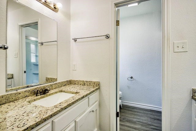 2307 Timber Ridge Dr, Portland, TX 78374 - bathroom featuring vanity and wood finished floors