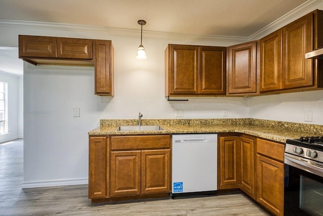 2307 Timber Ridge Dr, Portland, TX 78374 - kitchen with white dishwasher, stainless steel gas range, light wood finished floors, brown cabinetry, and stone countertops