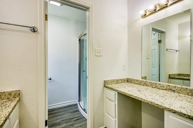 2307 Timber Ridge Dr, Portland, TX 78374 - bathroom with vanity, wood finished floors, and a shower stall