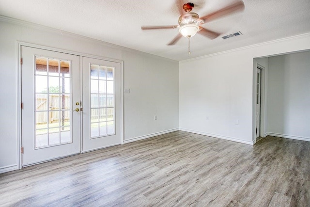 2307 Timber Ridge Dr, Portland, TX 78374 - empty room featuring crown molding, french doors, wood finished floors, and a ceiling fan