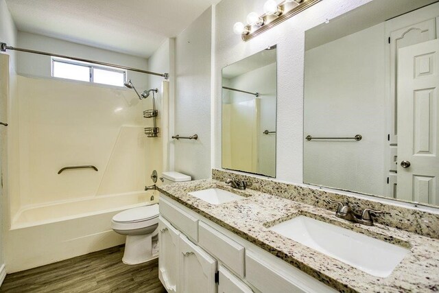 2307 Timber Ridge Dr, Portland, TX 78374 - full bathroom featuring wood finished floors, shower / bath combination, and double vanity