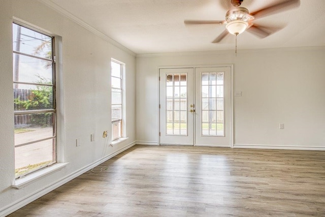 2307 Timber Ridge Dr, Portland, TX 78374 - empty room with french doors, crown molding, wood finished floors, and a ceiling fan