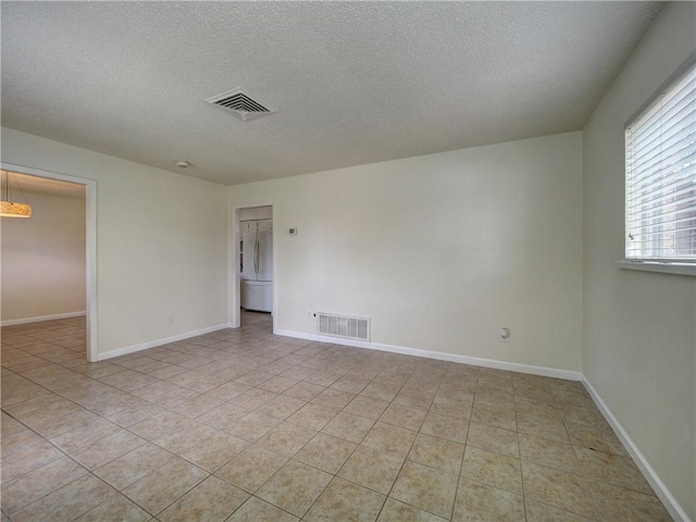 1638 Spicewood Dr, Corpus Christi, TX 78412 - unfurnished room featuring a textured ceiling and light tile patterned floors