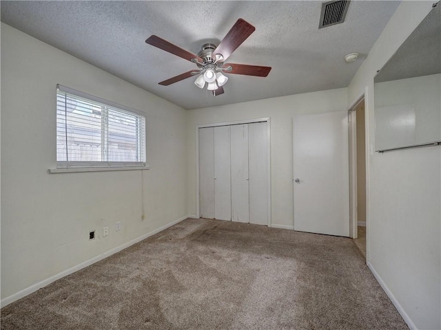 1638 Spicewood Dr, Corpus Christi, TX 78412 - unfurnished bedroom featuring carpet, a textured ceiling, a closet, and a ceiling fan